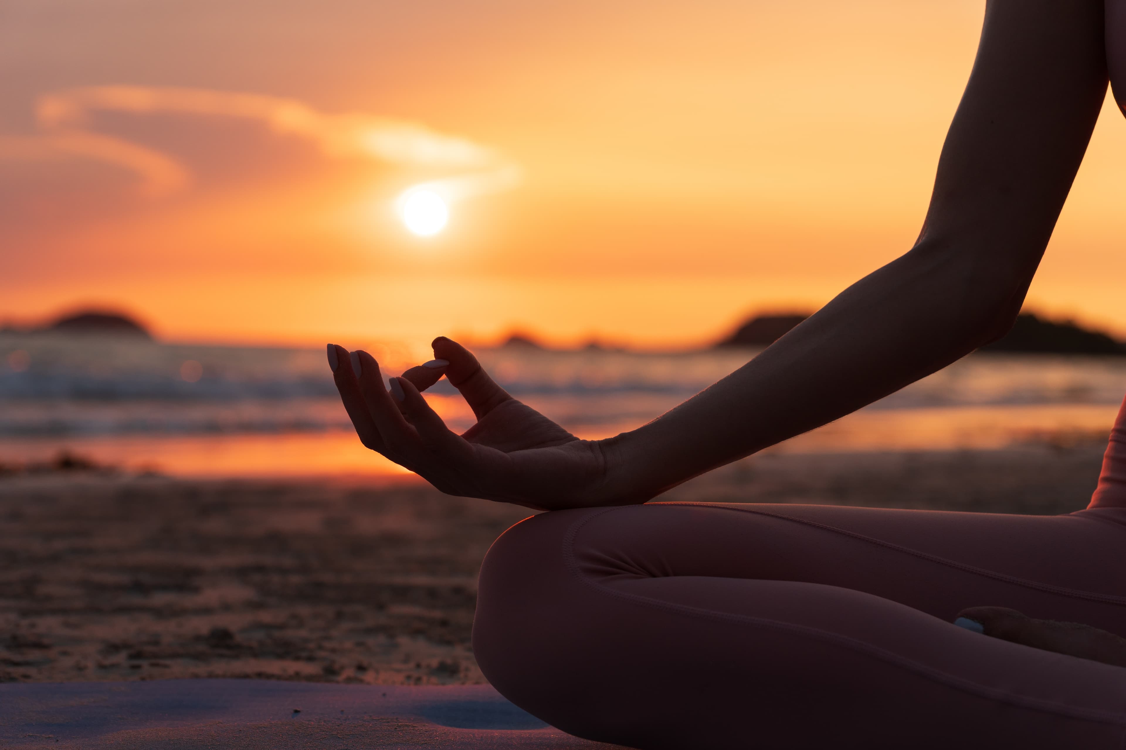 Sunset yoga mudra on the beach at Timi Yoga, Malta